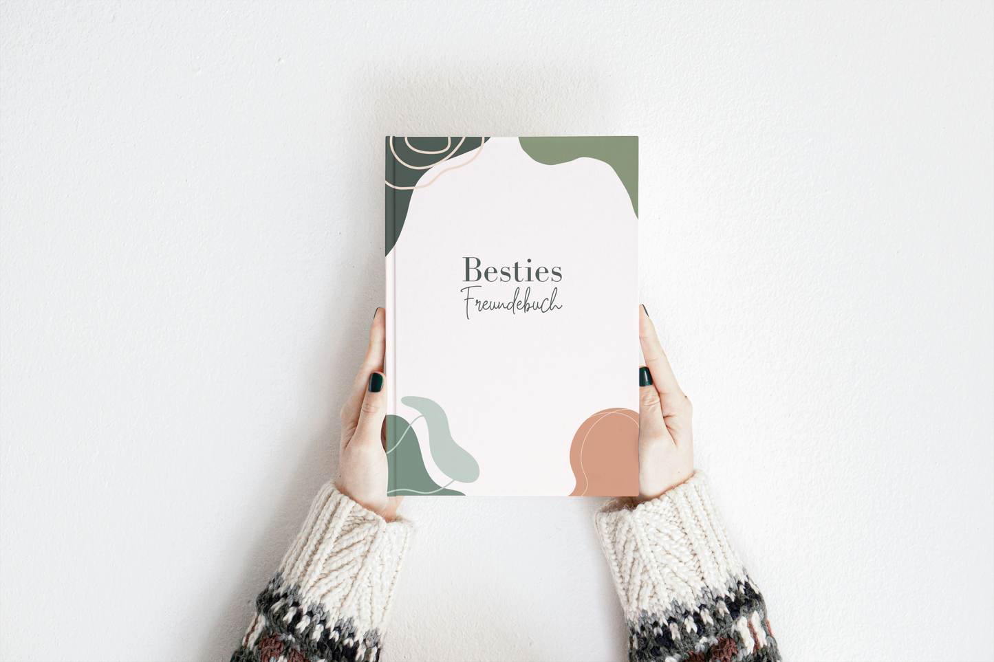 Kreatives Besties Freundebuch A5 Hardcover in Weiß mit abstrakten dunkelgrünen und schwarzen Formen und Schriftzug „Besties Freundebuch“.